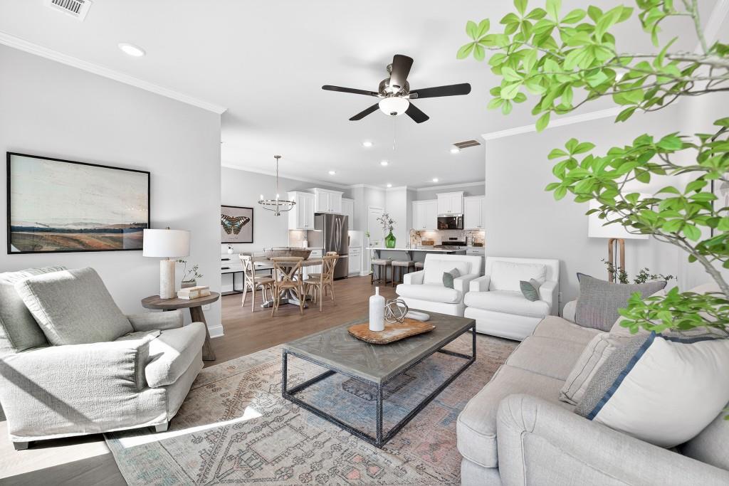 2789 Apperson Way Suwanee, GA 30024 - Photo 7 of 37 a living room with furniture and a chandelier