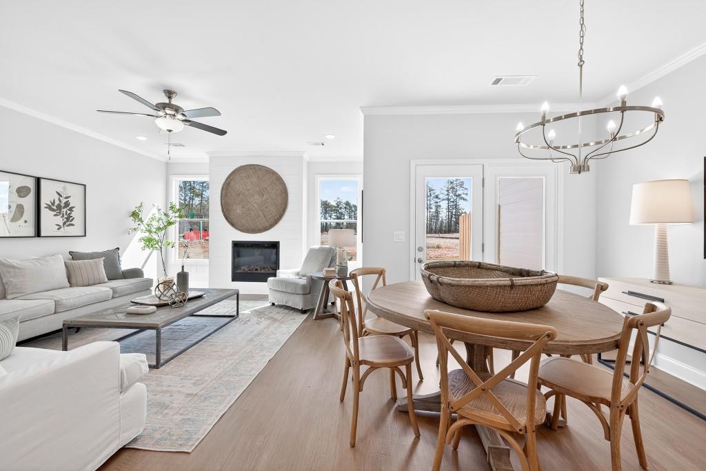 2789 Apperson Way Suwanee, GA 30024 - Photo 8 of 37 a living room with lots of furniture and a chandelier