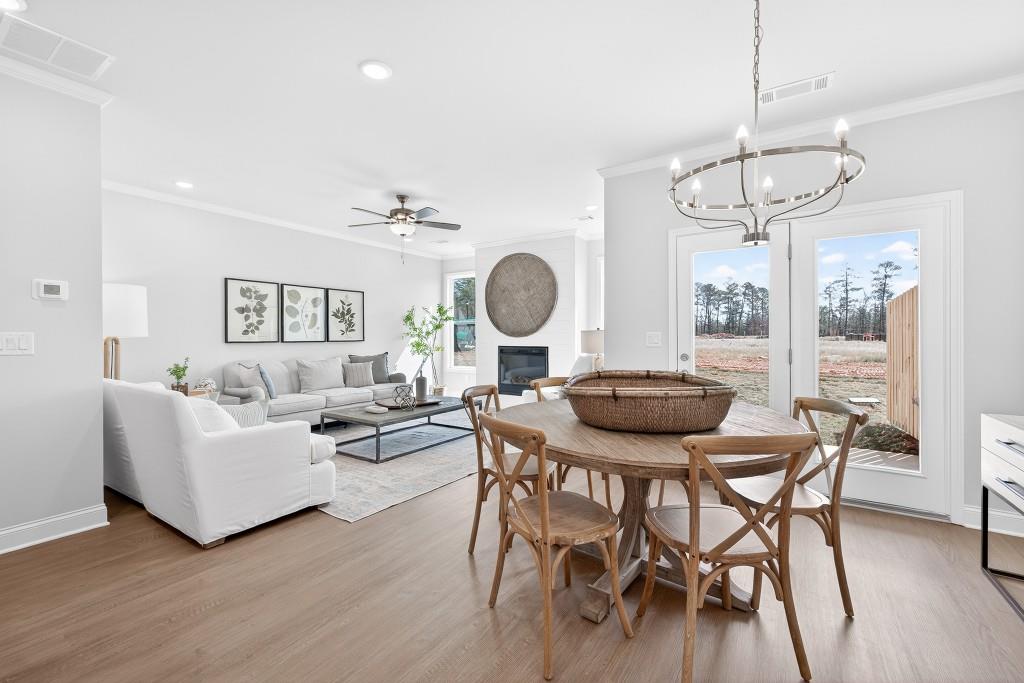2789 Apperson Way Suwanee, GA 30024 - Photo 9 of 37 a view of a dining room with furniture window and wooden floor