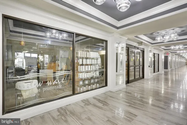 a view of a hallway with interior of the kitchen