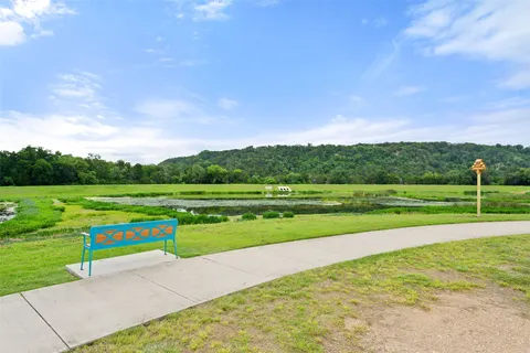 a view of a golf course with a lake