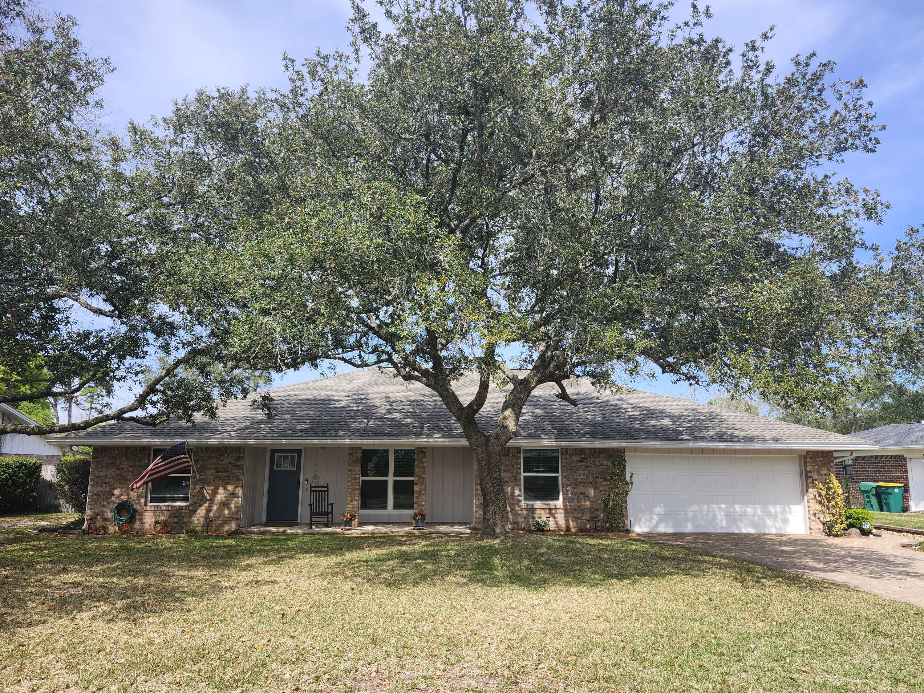 66 Lake Lorraine Circle Shalimar, FL 32579 - Photo 1 of 29 a house with swimming pool in front of it