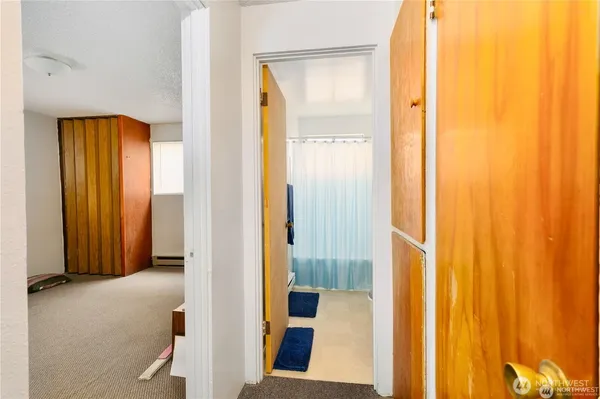 a bathroom with a sink toilet and shower curtain