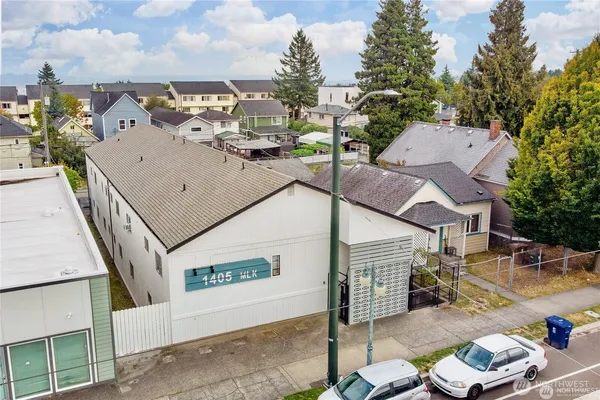 an aerial view of a house with outdoor seating