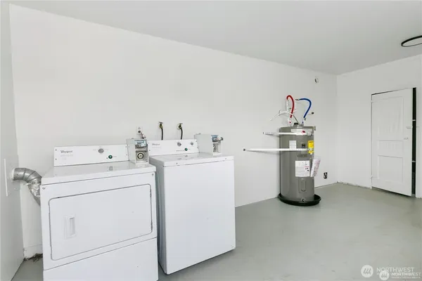 a view of a storage & utility room with a window