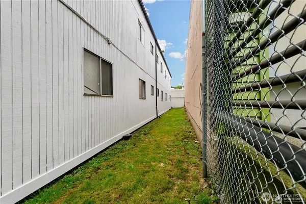 a view of a house with a cars park in front of a house