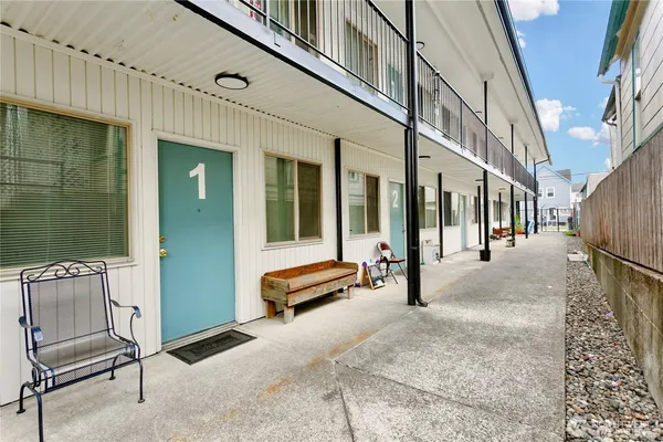 a view of a porch with wooden fence