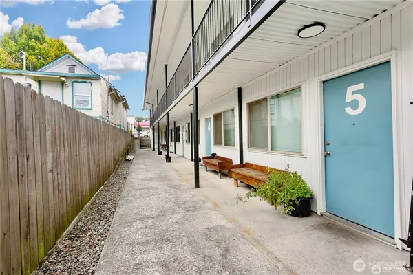 a living room with furniture fireplace and a window