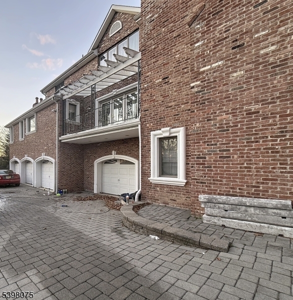 19 Powder Hill Road Saddle River, NJ 07458 - Photo 2 of 5 a front view of a house with a yard