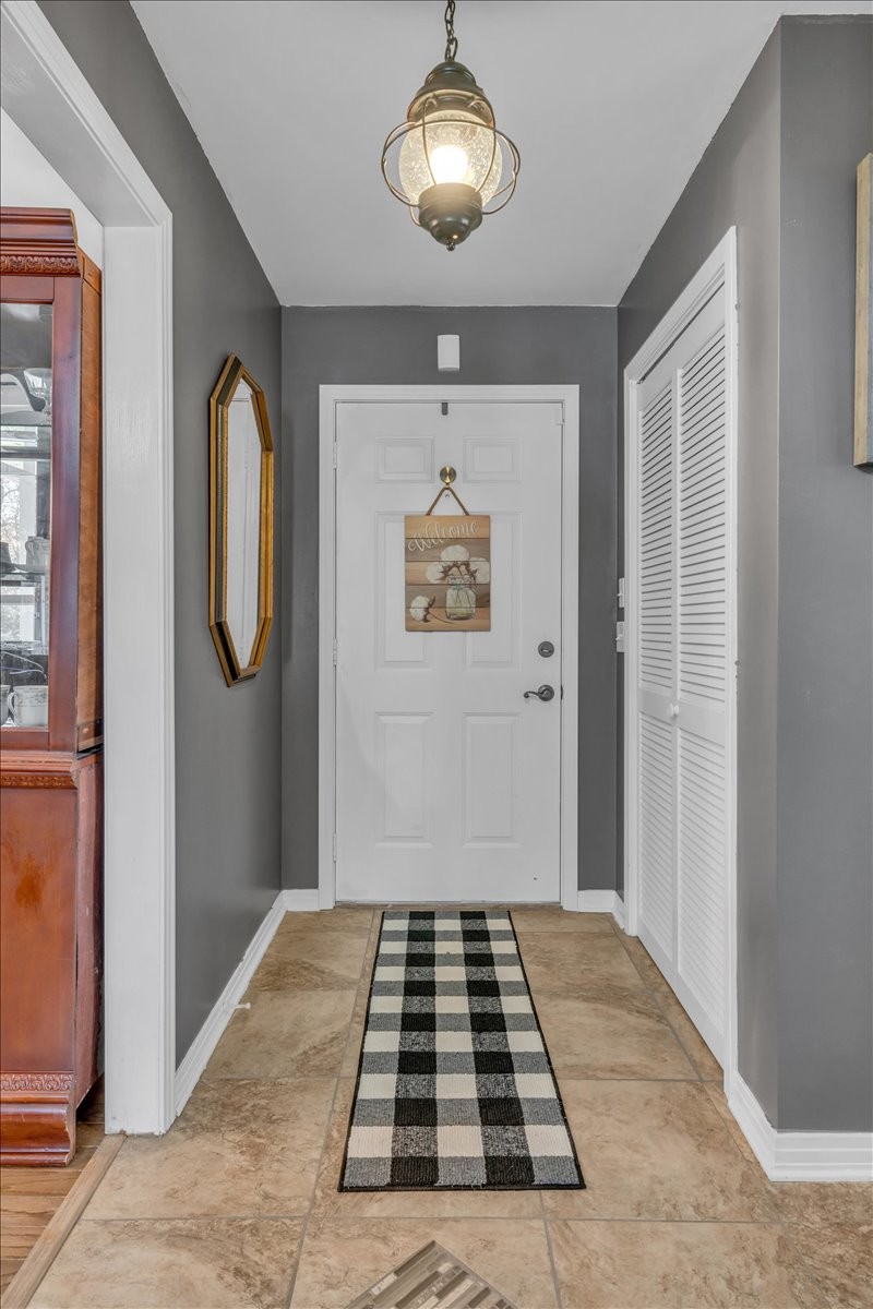 3404 Awalt Road Tullahoma, TN 37388 - Photo 11 of 84 a view of a hallway with wooden floor and a chandelier