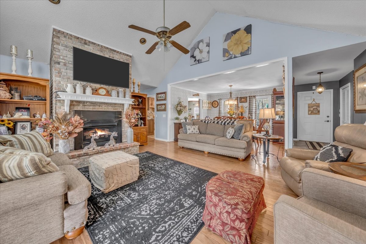 3404 Awalt Road Tullahoma, TN 37388 - Photo 13 of 84 a living room with furniture a flat screen tv and a fireplace