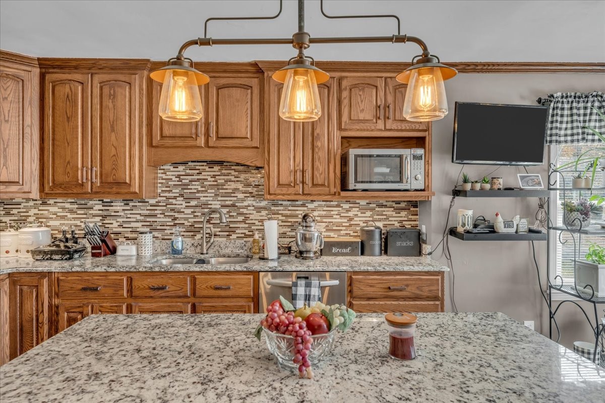 3404 Awalt Road Tullahoma, TN 37388 - Photo 21 of 84 a kitchen with stainless steel appliances granite countertop a sink and a microwave
