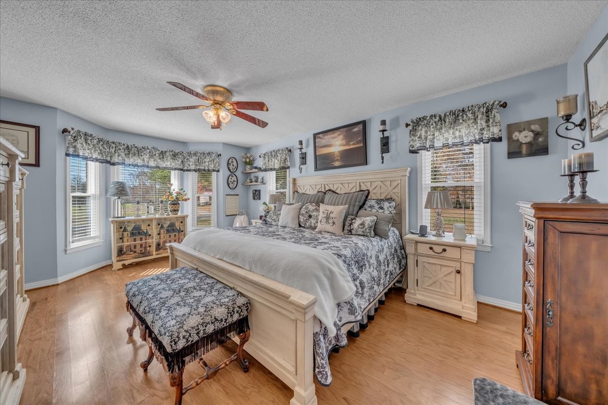 3404 Awalt Road Tullahoma, TN 37388 - Photo 30 of 84 a spacious bedroom with a bed and wooden floor