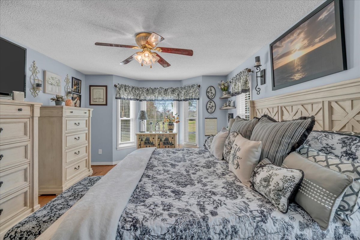 3404 Awalt Road Tullahoma, TN 37388 - Photo 31 of 84 a living room with furniture a flat screen tv and a dresser