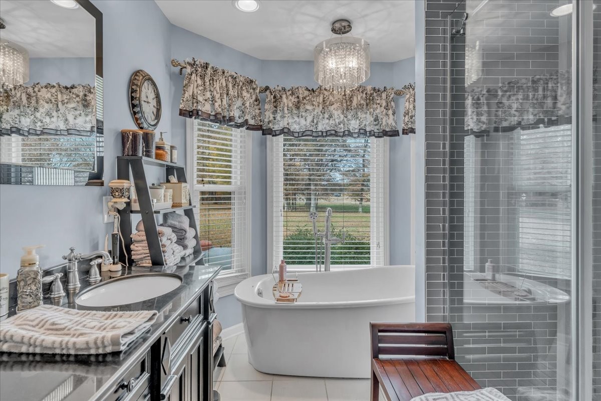 3404 Awalt Road Tullahoma, TN 37388 - Photo 34 of 84 a bathroom with a granite countertop sink and a mirror