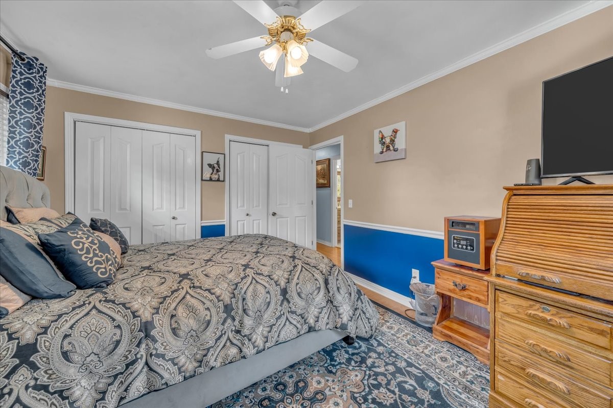 3404 Awalt Road Tullahoma, TN 37388 - Photo 39 of 84 a bedroom with a bed and a flat screen tv