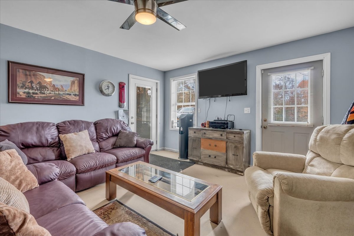 3404 Awalt Road Tullahoma, TN 37388 - Photo 59 of 84 a living room with furniture and a flat screen tv