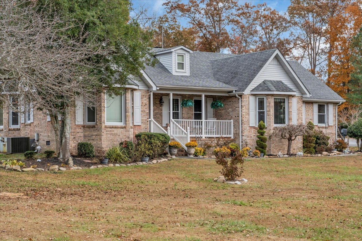 3404 Awalt Road Tullahoma, TN 37388 - Photo 6 of 84 a front view of a house with a yard