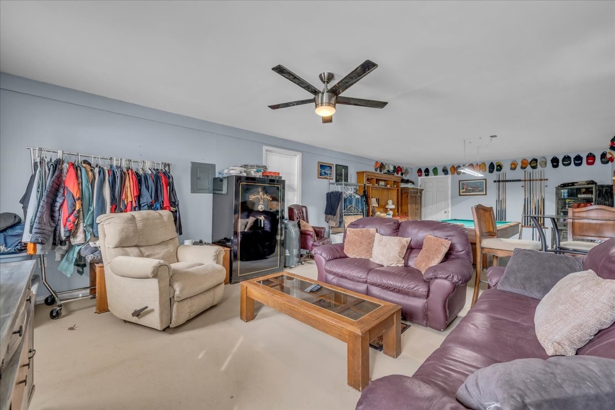 3404 Awalt Road Tullahoma, TN 37388 - Photo 62 of 84 a living room with furniture and a flat screen tv