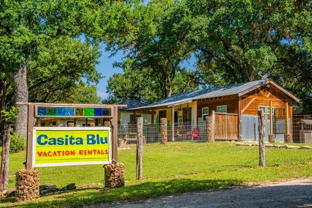 a view of an house with garden and deck