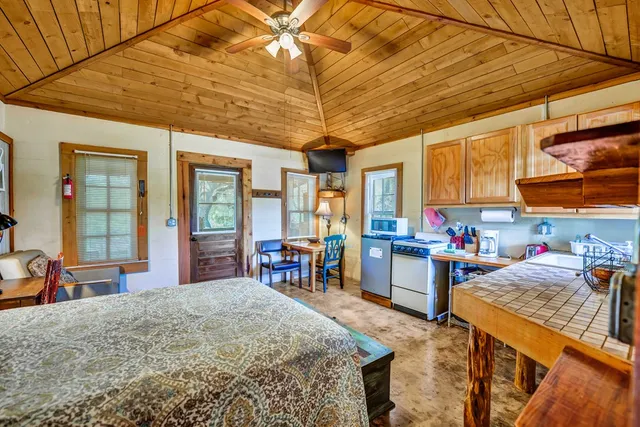 a bedroom with furniture and a window