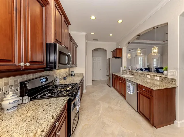 a utility room with cabinets washer and dryer