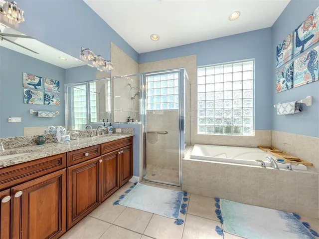 an aerial view of a city with lots of residential buildings lake and ocean view