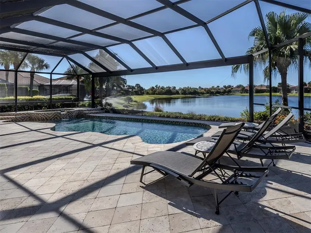 a view of a lake with houses in the back
