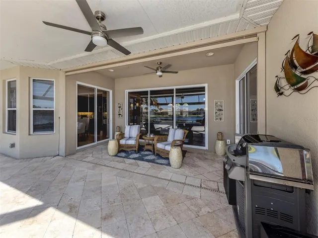 a view of swimming pool with outdoor seating and deck