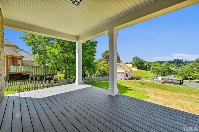 a view of hallway with wooden floor