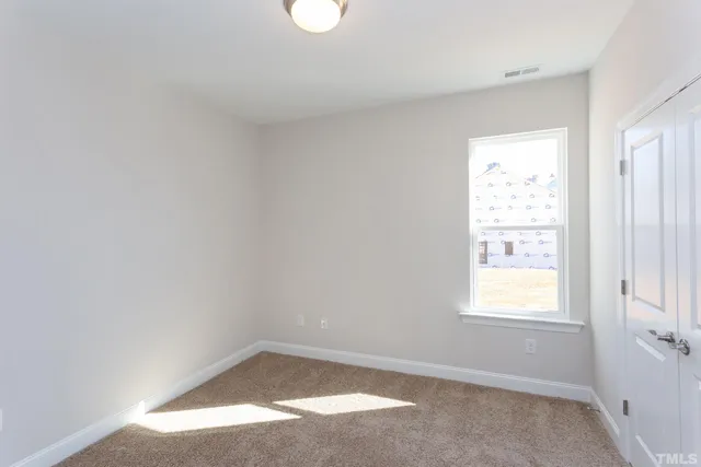 a view of a kitchen and dining room with wooden floor