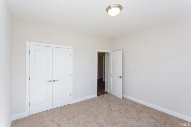 a kitchen with stainless steel appliances granite countertop a stove a sink a refrigerator and a oven