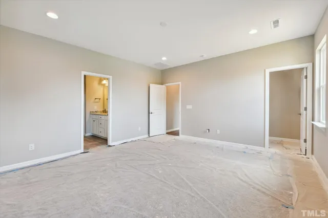 a bathroom with a granite countertop sink a toilet and bathtub