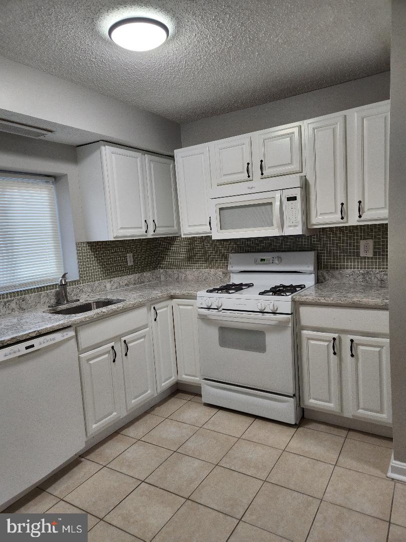 11911 Tarragon Road, Unit A Reisterstown, MD 21136 - Photo 3 of 12 New gas range and microwave