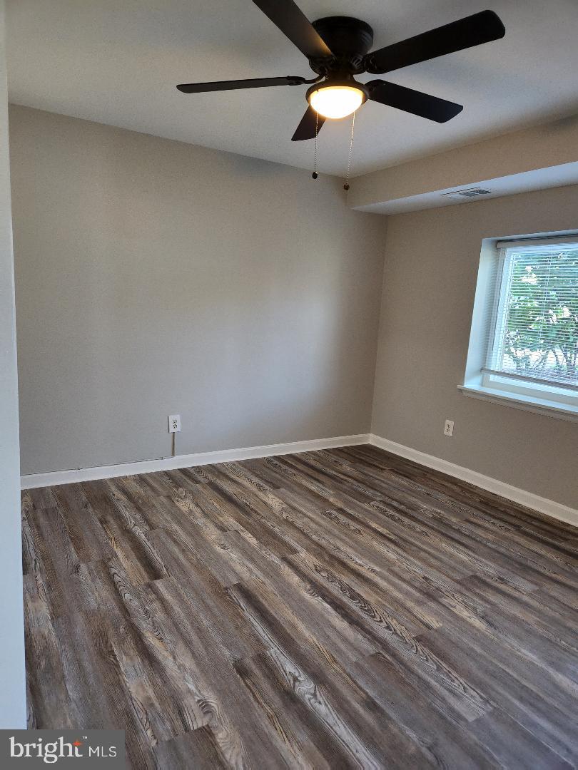 11911 Tarragon Road, Unit A Reisterstown, MD 21136 - Photo 6 of 12 Living room with ceiling fan