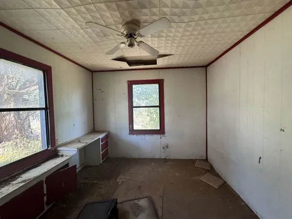 a view of an empty room with a window