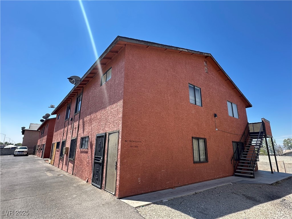 2305 Exeter Drive Las Vegas, NV 89156 - Photo 5 of 6 View of side of home with stairway and stucco siding