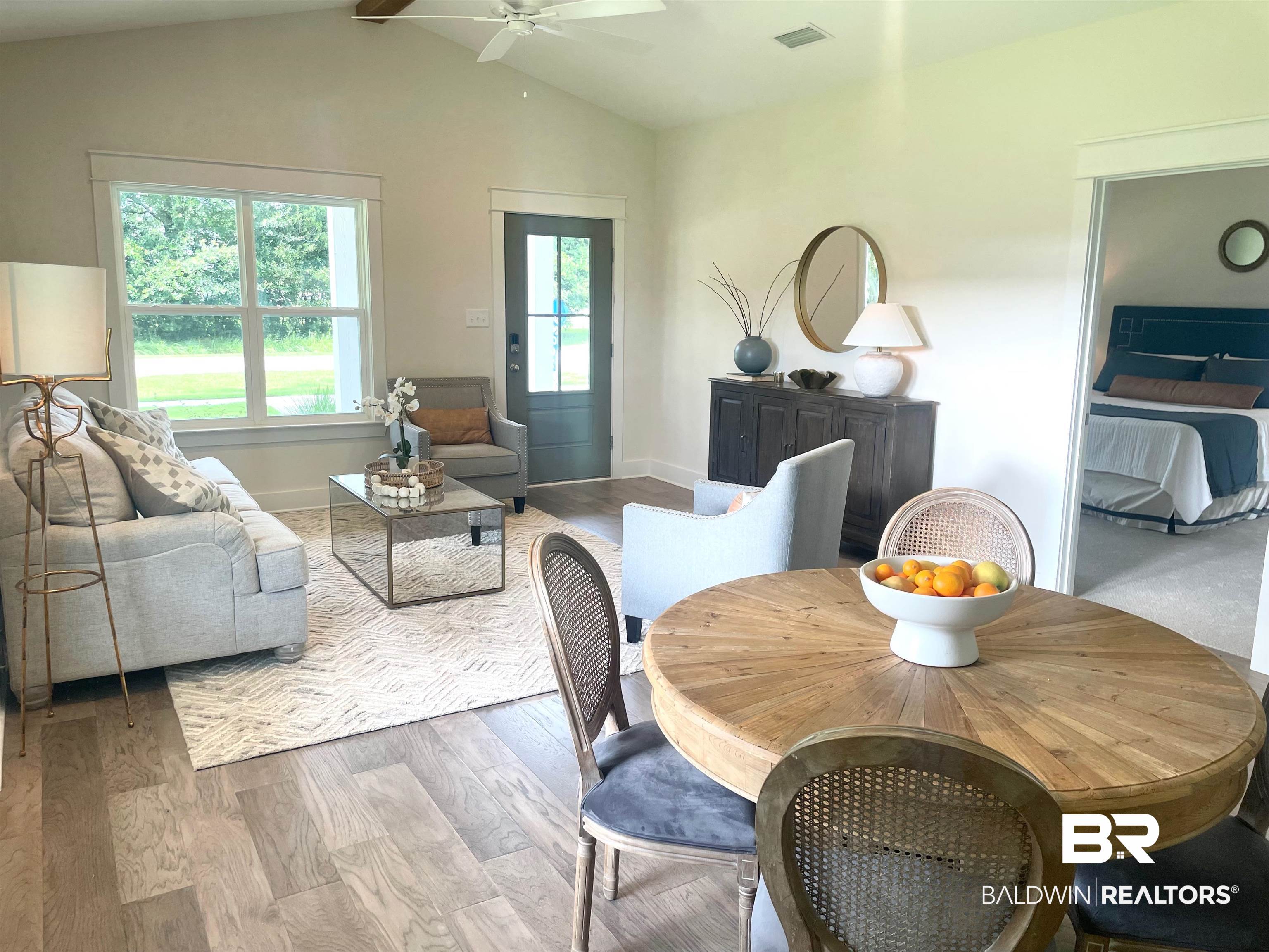 14710 Camelia Street Magnolia Springs, AL 36555 - Photo 4 of 23 Dining area featuring ceiling fan, hardwood / wood-style floors, and lofted ceiling