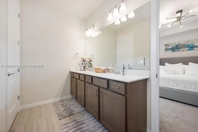 a bathroom with a glass shower door