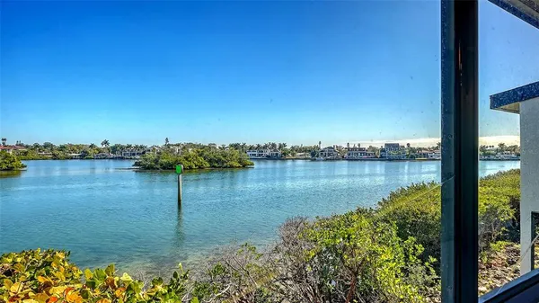 a view of lake with green space