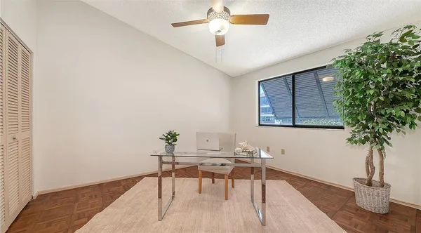 a view of a livingroom with furniture and window