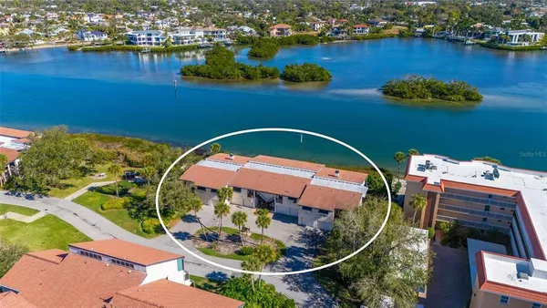 an aerial view of a house with a ocean view