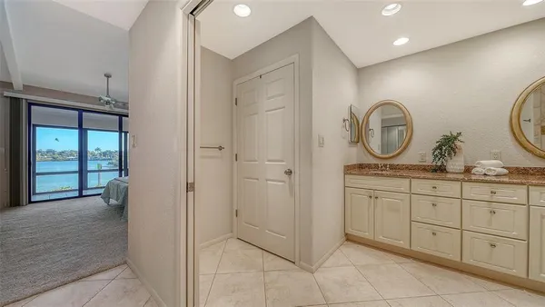 a bathroom with a double vanity sink and a mirror