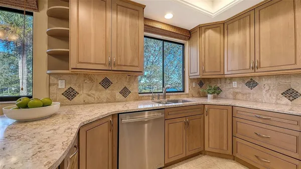 a kitchen with a sink and wooden cabinets