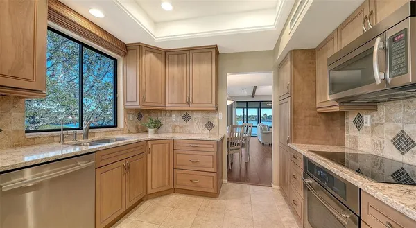 a kitchen that has a sink and cabinets