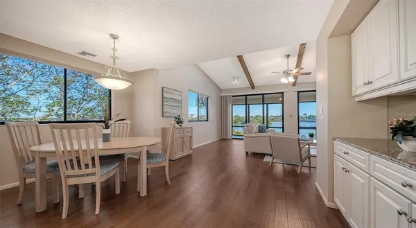 a view of a dining room with furniture window and wooden floor