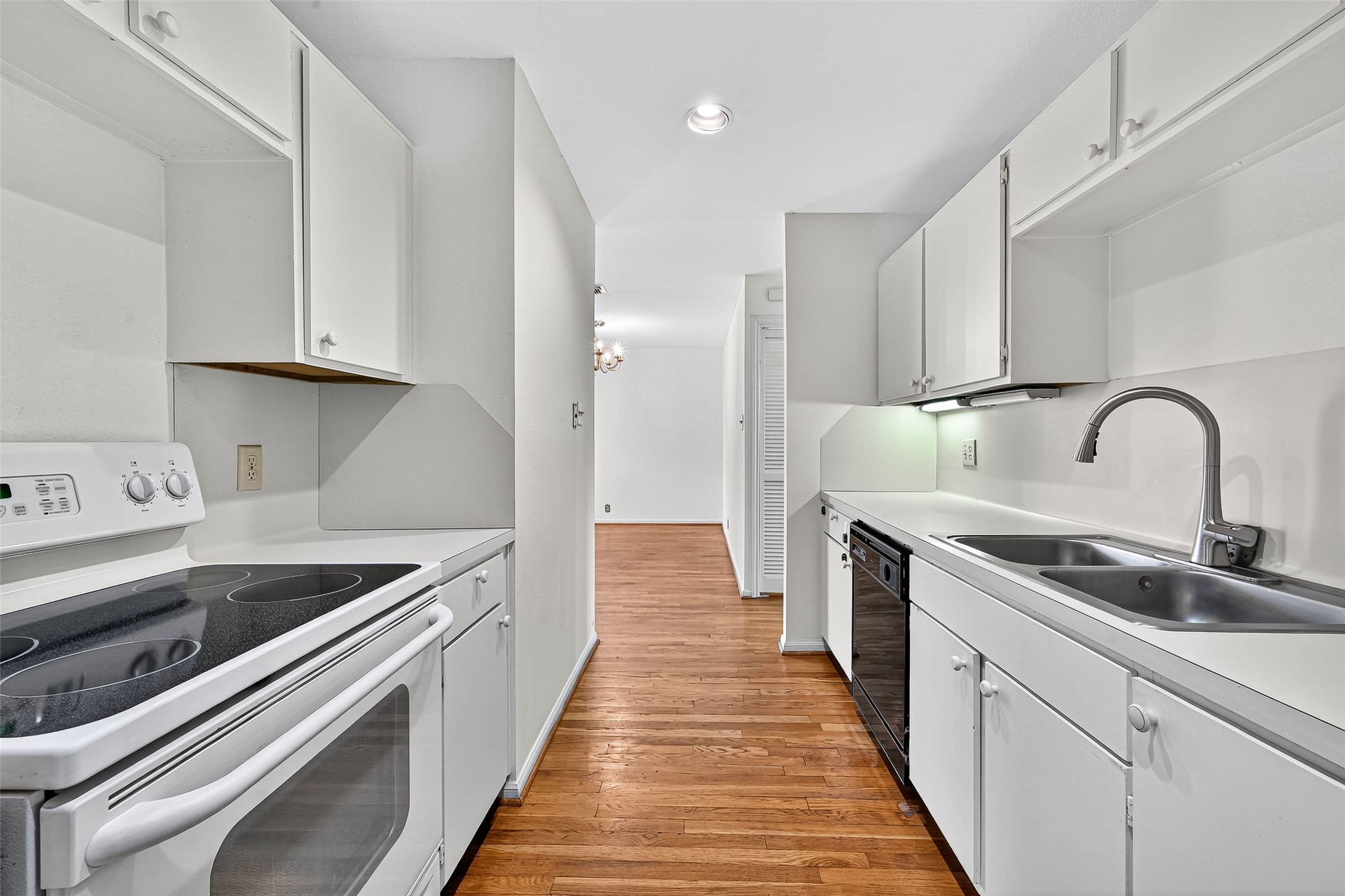 2829 Timmons Lane, Unit 176 Houston, TX 77027 - Photo 15 of 34 a kitchen with stainless steel appliances granite countertop a sink and a stove