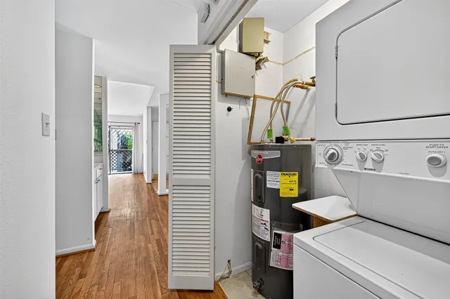 a kitchen with a sink and a wooden floor