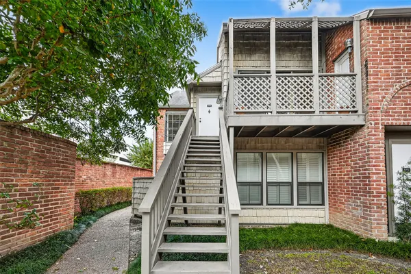 a front view of a house with garage
