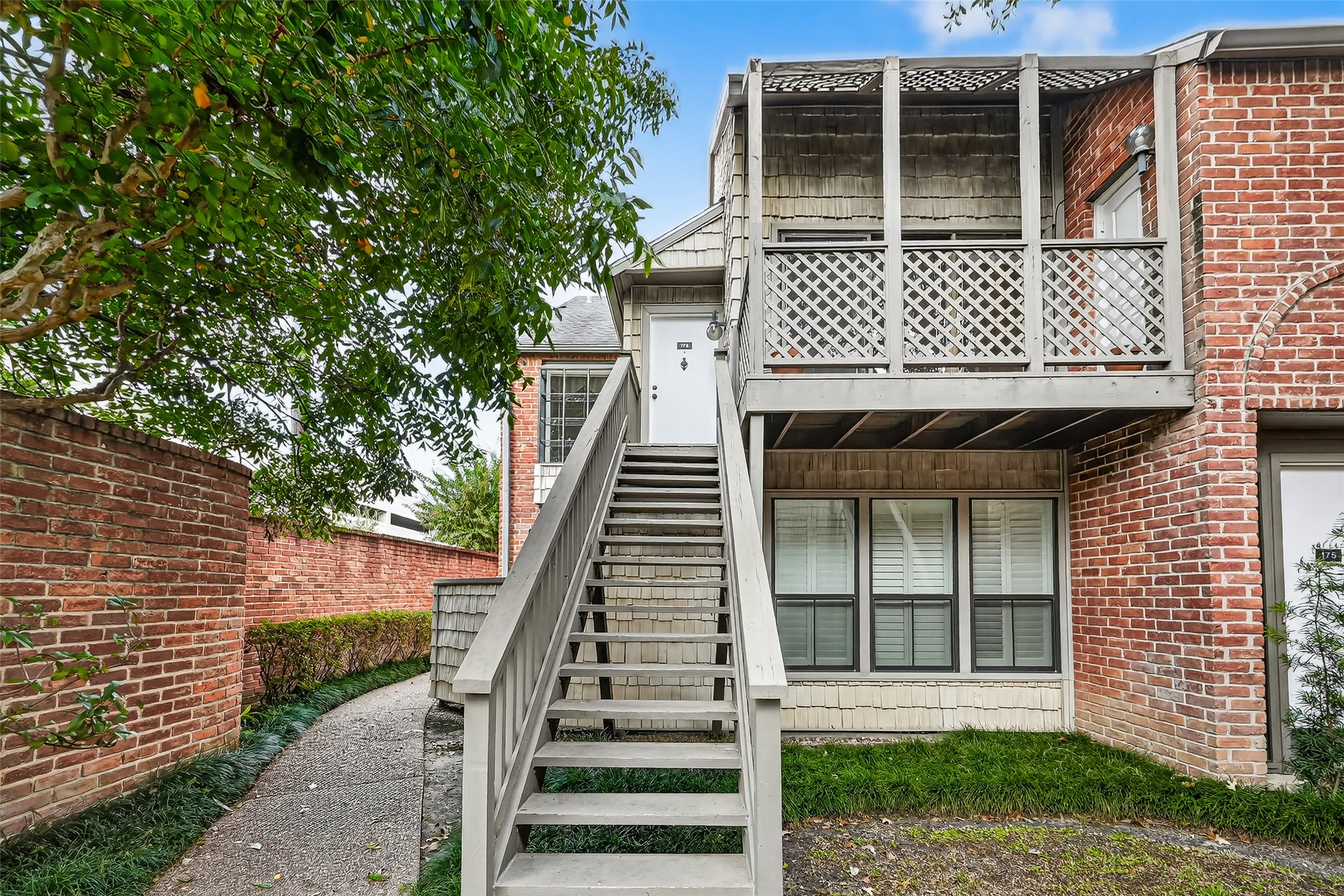 2829 Timmons Lane, Unit 176 Houston, TX 77027 - Photo 2 of 34 a front view of a house with garage